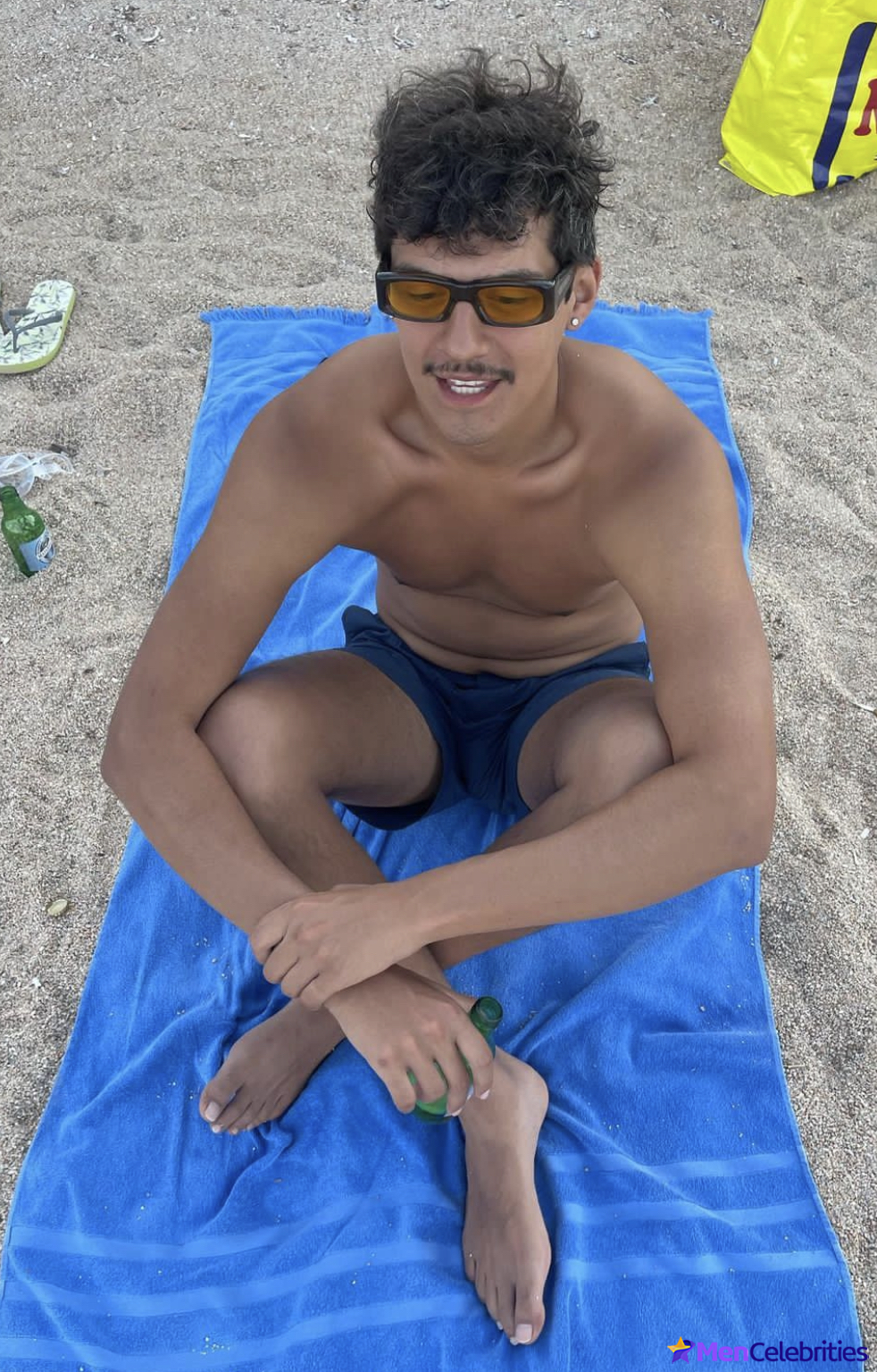 Omar Apollo on a beach