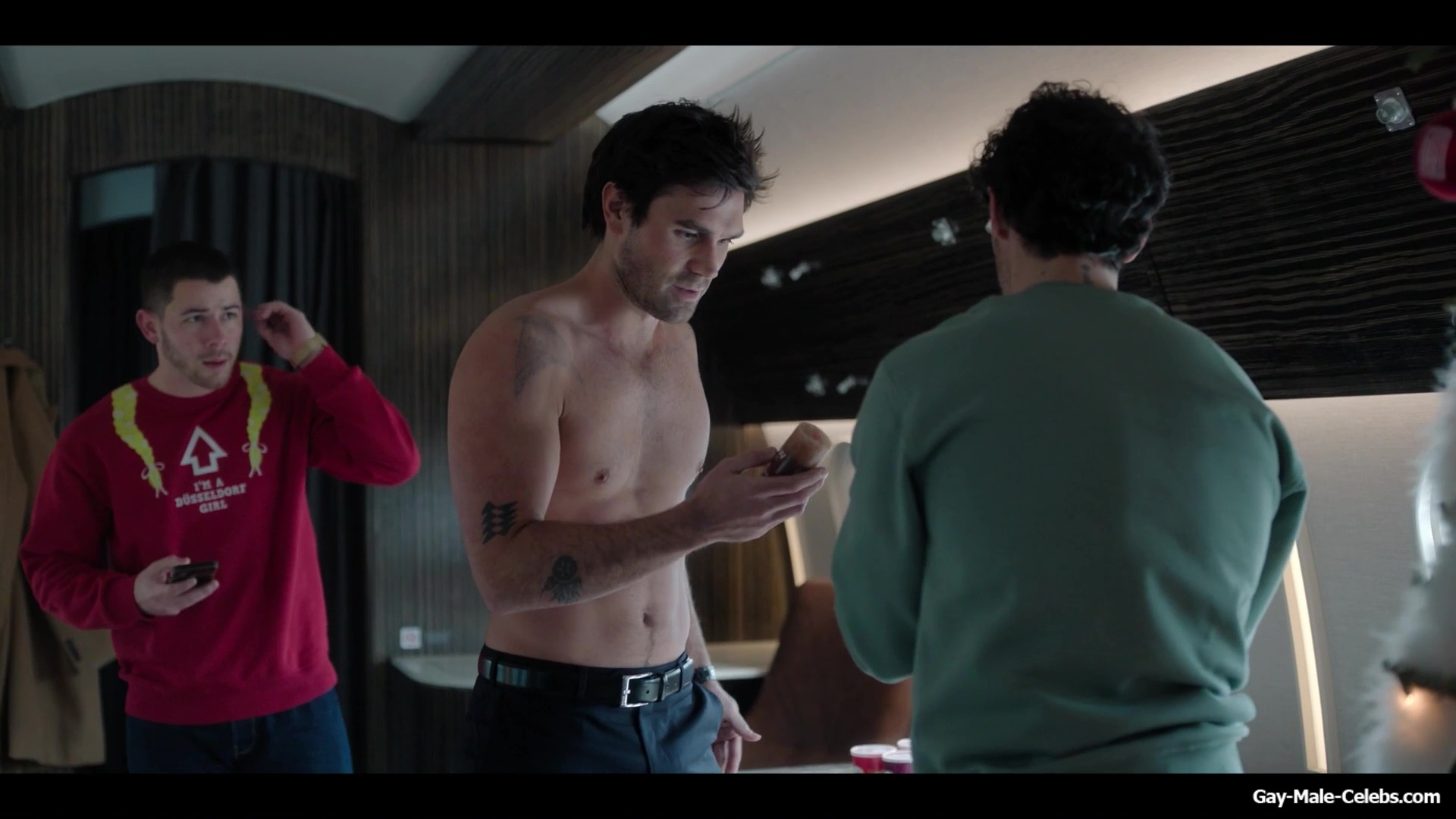 KJ Apa shirtless in A Very Jonas Christmas Movie