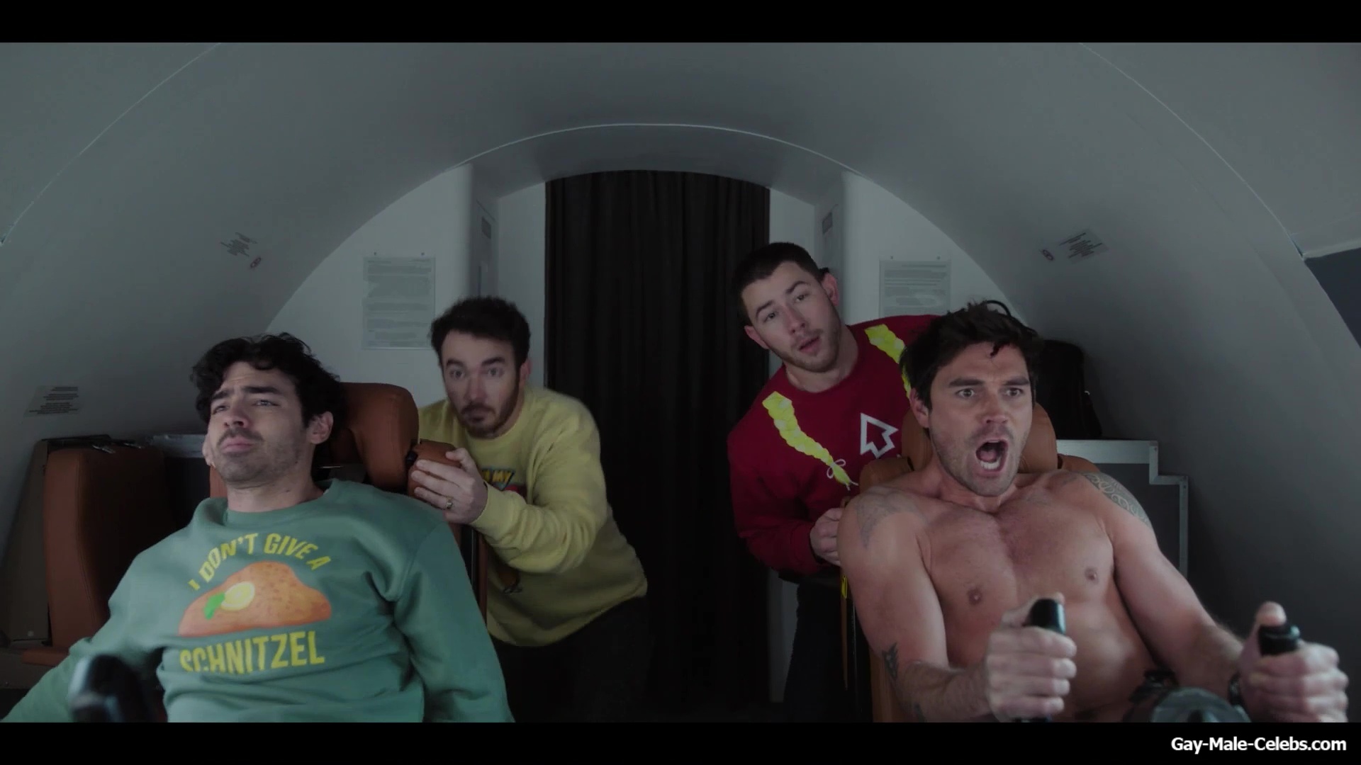 KJ Apa shirtless in A Very Jonas Christmas Movie