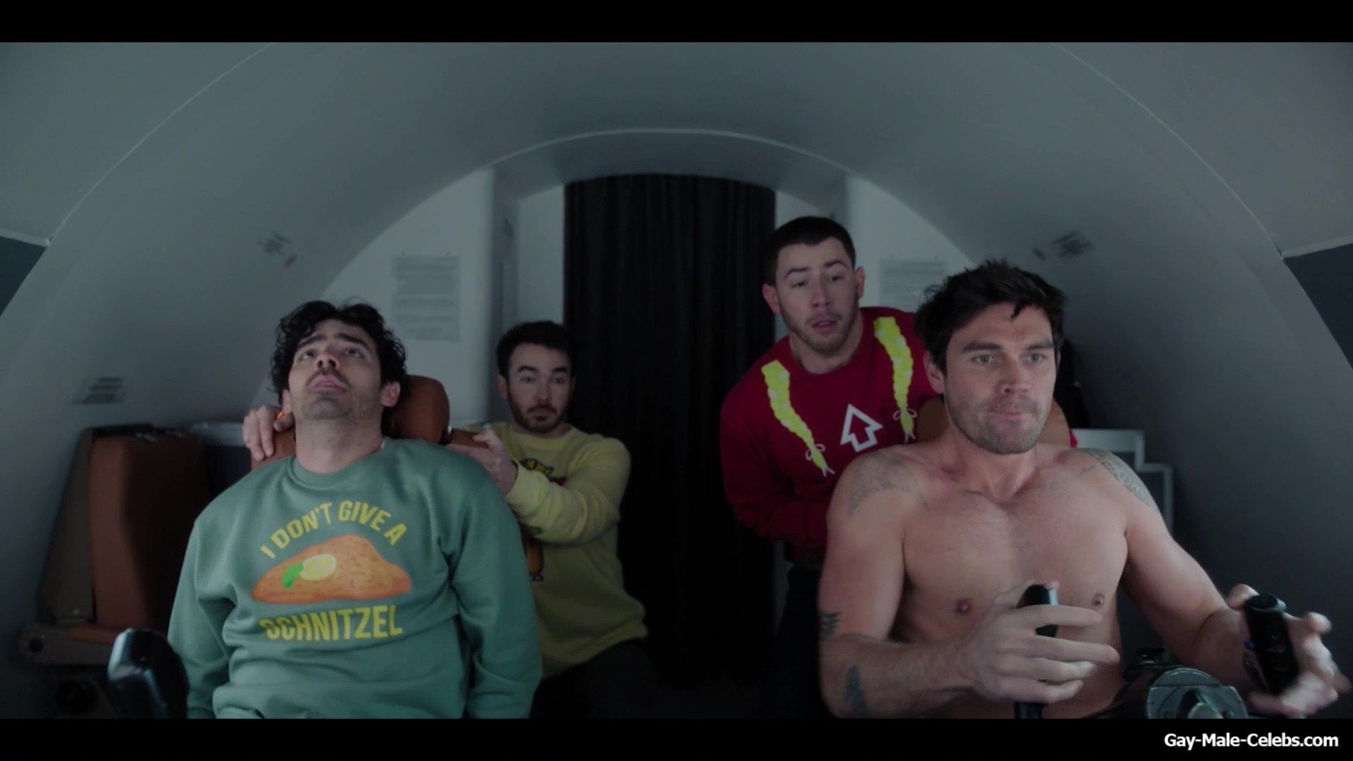 KJ Apa shirtless in A Very Jonas Christmas Movie