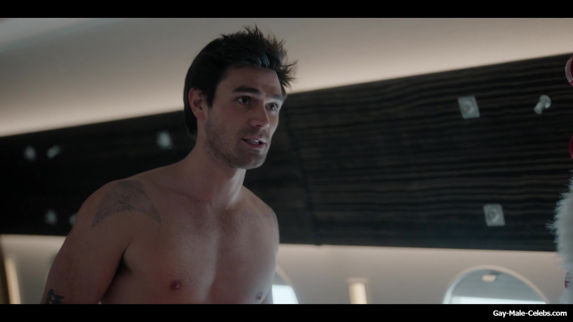 KJ Apa shirtless in A Very Jonas Christmas Movie