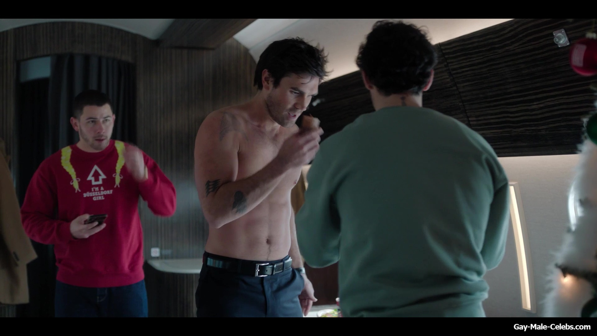 KJ Apa shirtless in A Very Jonas Christmas Movie