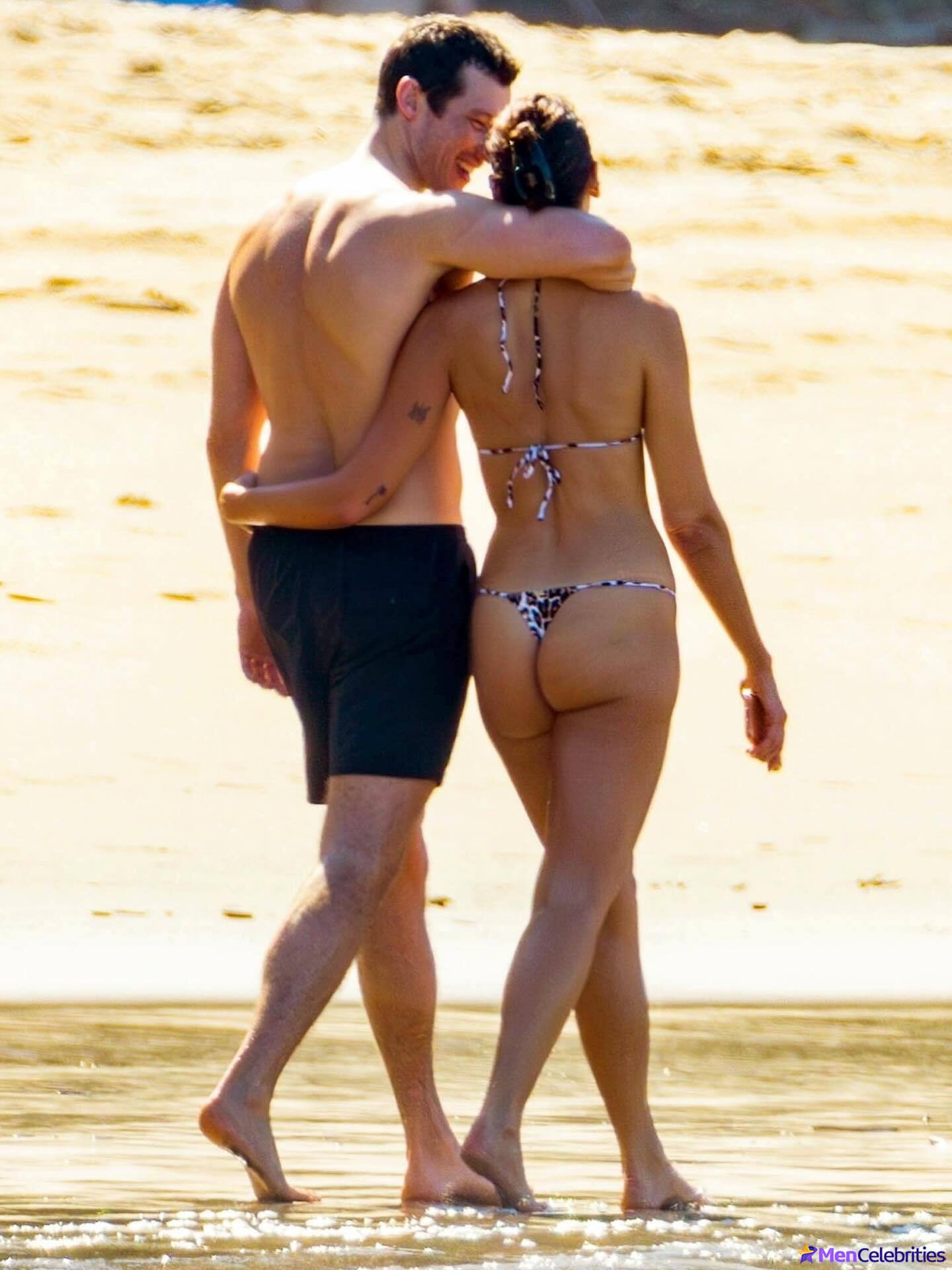 Callum Turner shirtless on beach