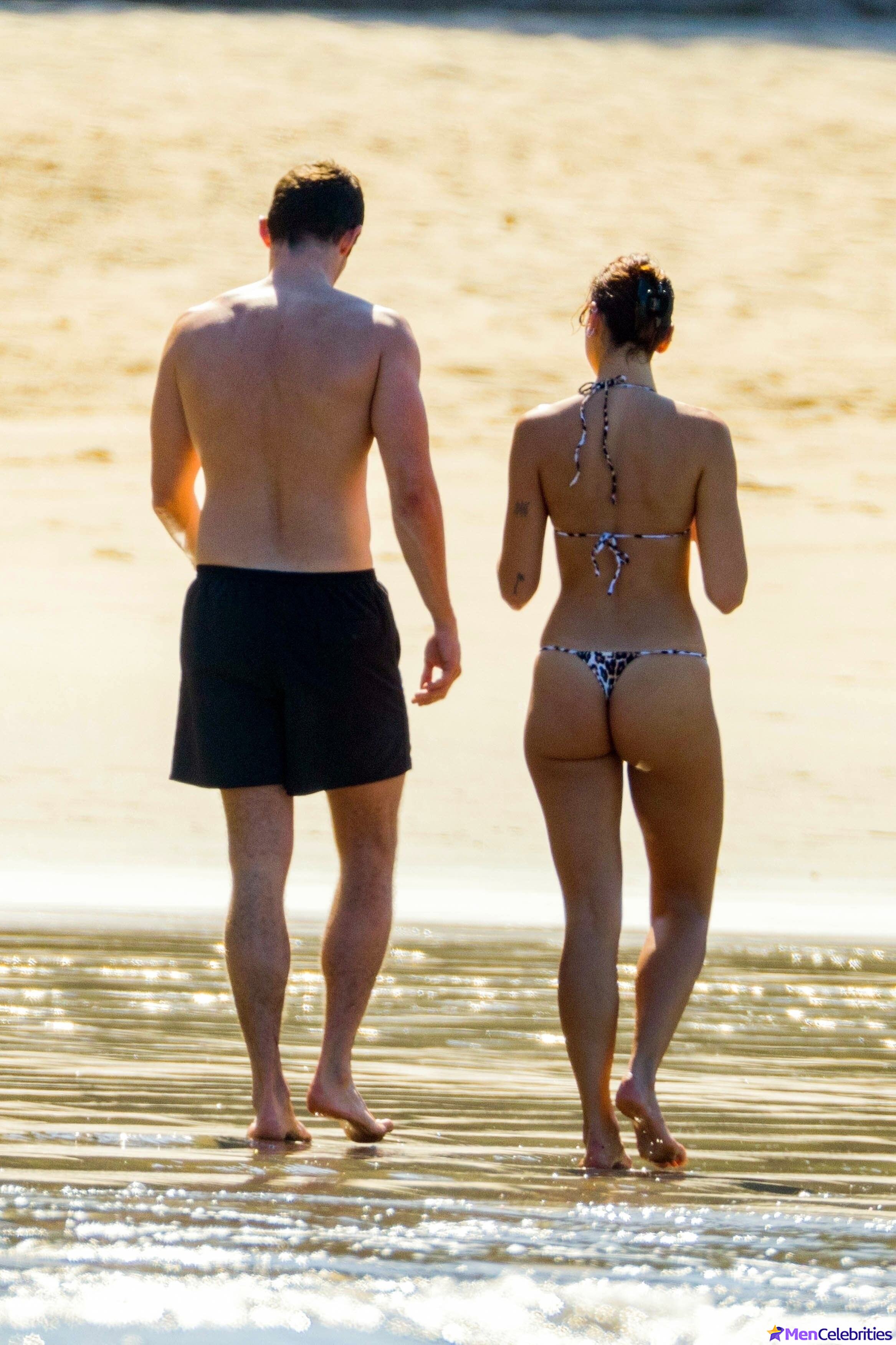 Callum Turner shirtless on beach