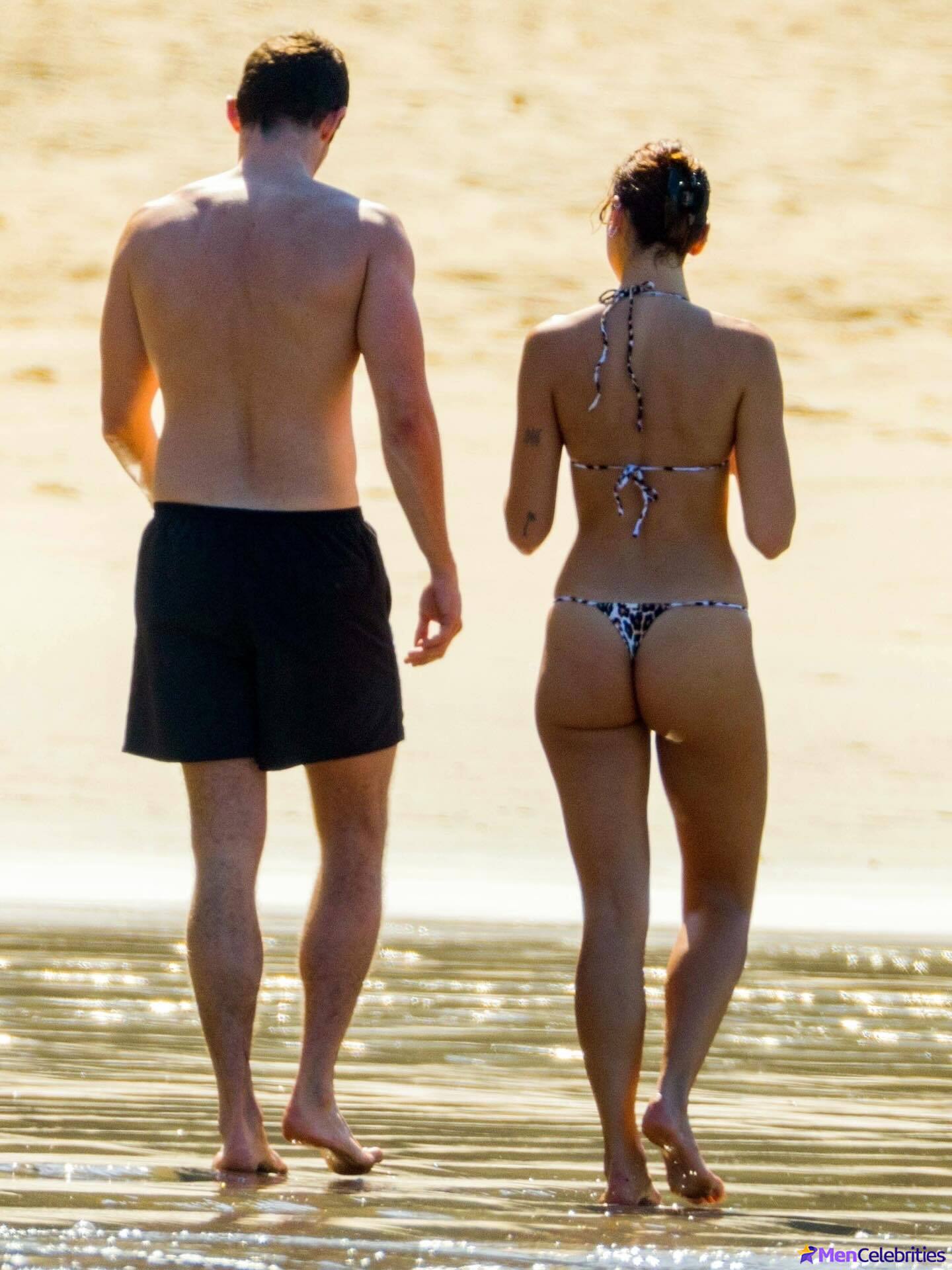 Callum Turner shirtless on beach