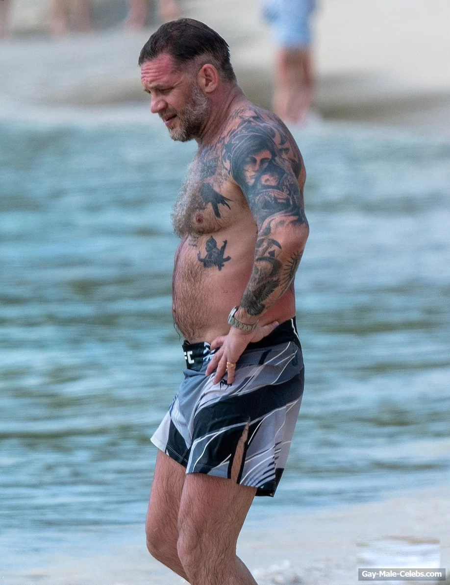 Tom Hardy shirtless on a beach