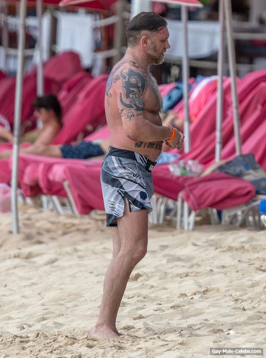 Tom Hardy shirtless on a beach