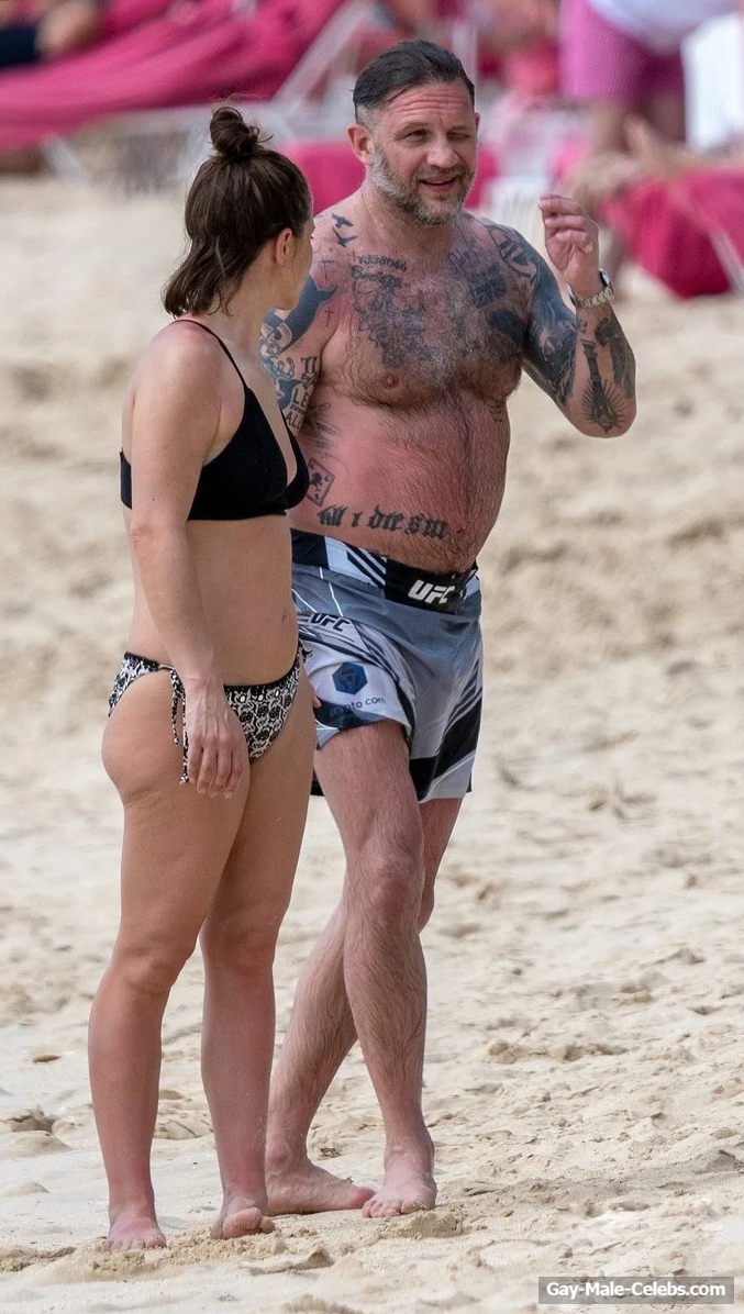 Tom Hardy shirtless on a beach