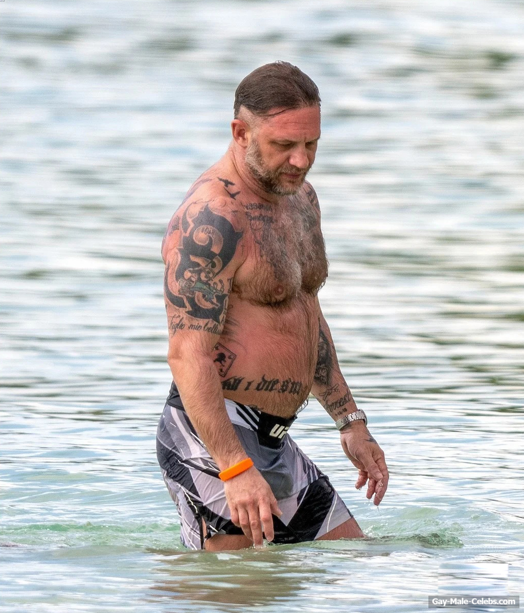 Tom Hardy shirtless on a beach