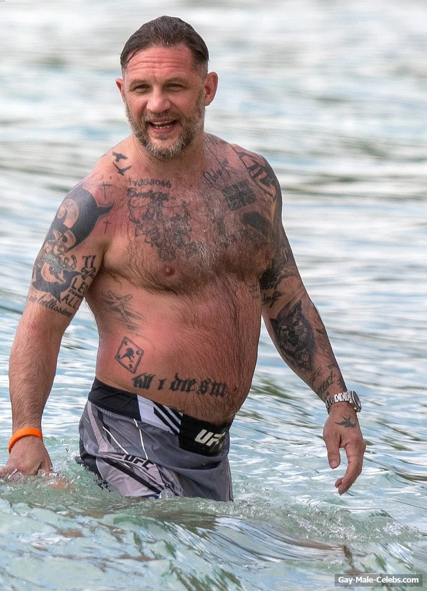 Tom Hardy shirtless on a beach