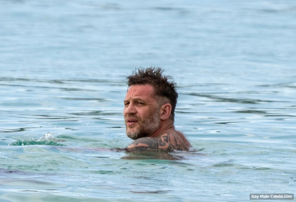 Tom Hardy shirtless on a beach